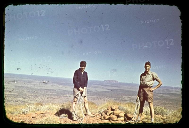 Expedition of the Melbourne Grammar School, Northern Territory, Australia, 1956, tow boys with climbing ropes at the Olgas, Kata Tjuta, view back to Ayers Rock, Uluru, Oceania