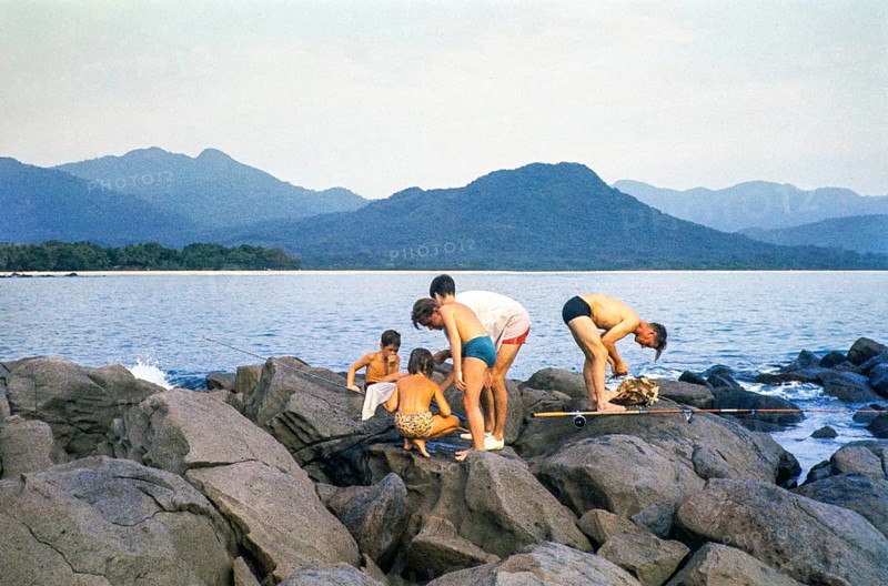 Emigrants from Europe, men and children fishing on rocks on the coast, Sierra Leone, West Africa 1963 1964, Africa