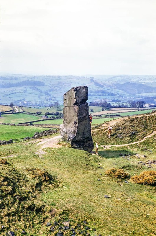 People climbing Alport Stone, Alport Heights, Wirksworth, Peak District National Park, Derbyshire, England, UK 1956
