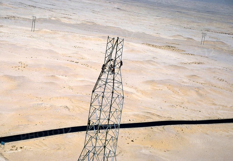 Oil industry in the Ras Tanura region, Saudi Arabia, 1979 Men building a drilling rig in the desert, Asia