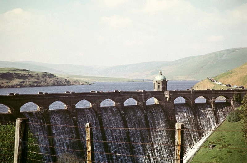 Water flowing over the dam wall from the reservoir, Pen y Garreg, Elan Valley, Rhayader, Powys, Wales, UK 1959