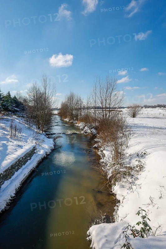Hamm, North Rhine-Westphalia, Germany - Sunny winter landscape in the Ruhr area, ice and snow on the river Lippe, fish ladder, Lippe branch diversion