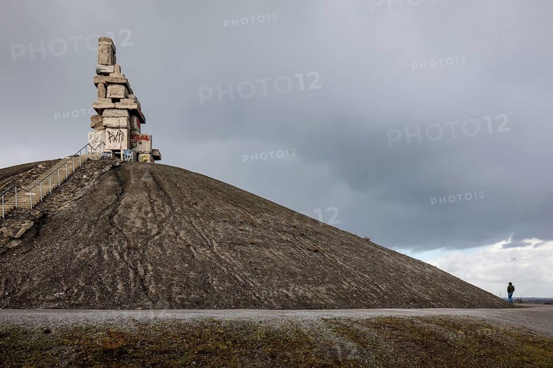 Gelsenkirchen, North Rhine-Westphalia, Germany - Rheinelbe slagheap with artwork Himmelstreppe made of old concrete parts of the former Rheinelbe colliery in front of a dark sky, artist Herman Prigann