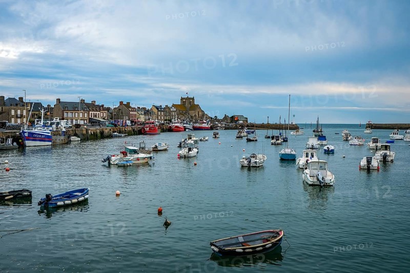 Barfleur, Normandy, France - Fishing boats on the quay in the harbour of Barfleur, a picturesque fishing village, a French commune in the Manche department on the Cotentin peninsula in the Normandy region