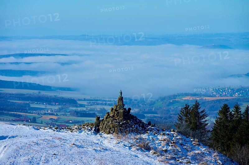 Winter landscape with snow-covered hill and aviation monument, cloudy sky and wide view, Wasserkuppe, Gersfeld, Rhön, Hesse, Germany, Europe