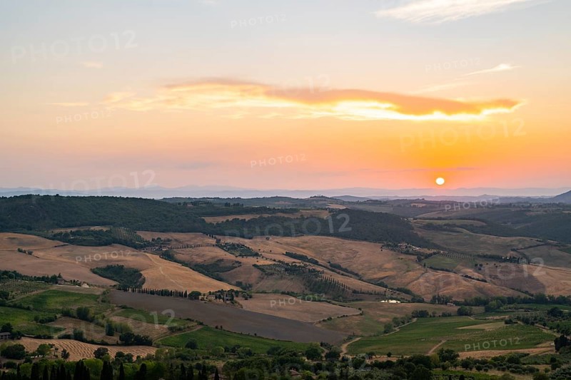 View from Montepulciano into a typical Tuscan landscape in Val d'Orcia with hills, trees, fields, cypresses and farm houses in summer, Montepulciano, Tuscany, Italy, Europe