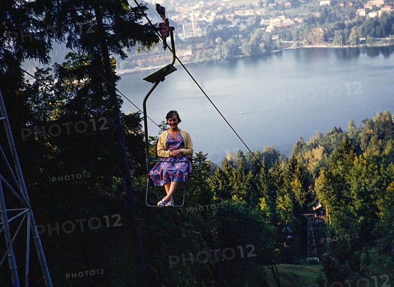 Young woman sitting in chairlift above the Lake Bled, Bled, Slovenia, former Yugoslavia, Europe 1959, Europe