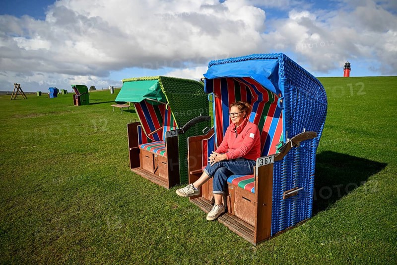 Woman in a beach chair on the island of Pellworm, Wadden Sea National Park, North Frisia, Germany, Europe