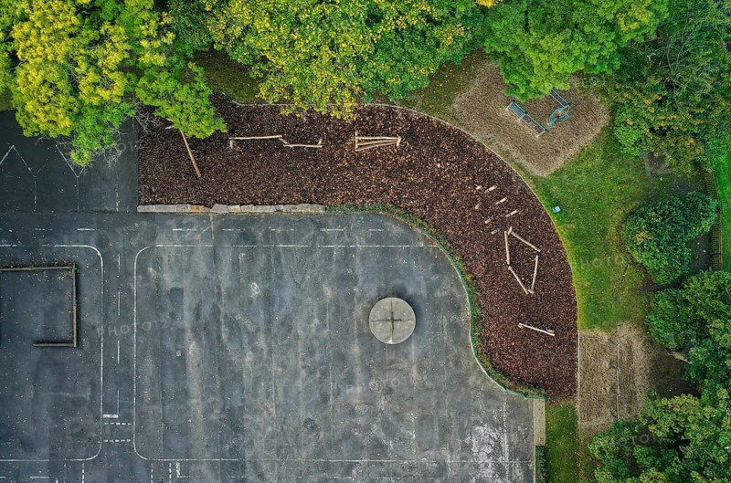 Mülheim an der Ruhr, North Rhine-Westphalia, Germany - Schoolyard unsealing, view from above of the newly designed schoolyard area of the primary school on Filchnerstraße Children can play here and, by unsealing the area, rainwater can seep into the groundwater, irrigate plants and cool the surroundings through evaporation