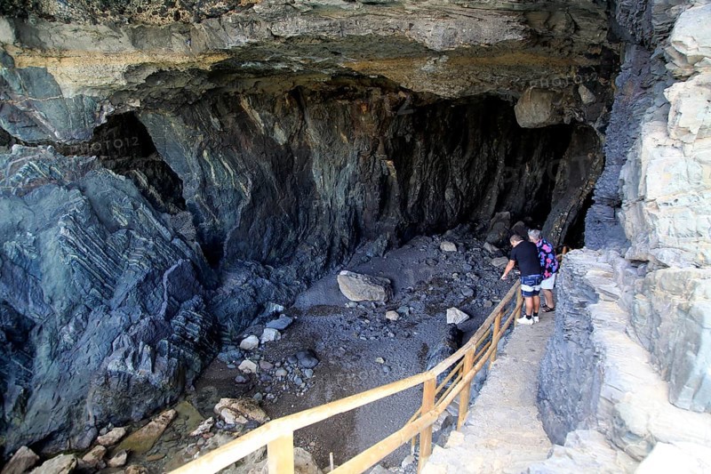 People exploring the sea caves at Ajuy, Fuerteventura, Canary Islands, Spain, Europe