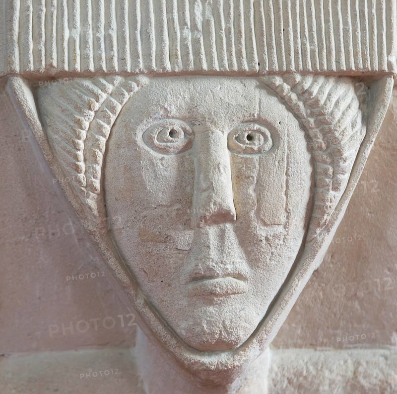 Stonework carved head of woman, church of Saint Michael, Yanworth, Gloucestershire, England, UK