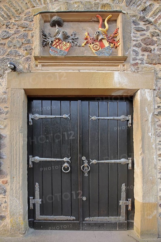 Door with fittings and historical coat of arms at Oberstein Castle, Idar-Oberstein, Hunsrück, Rhineland-Palatinate, Germany, Europe