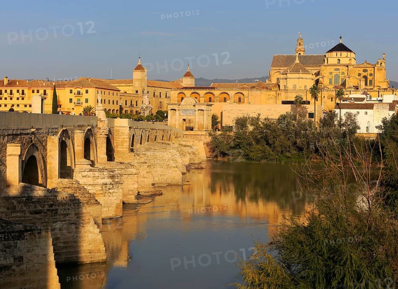 Roman bridge spanning river Rio Guadalquivir leading to the cathedral buildings, Cordoba, Spain, Europe