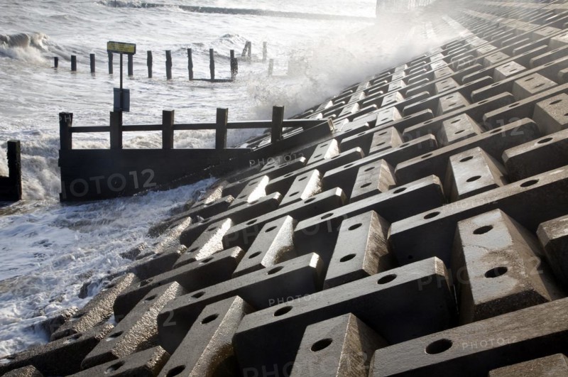 Wave swash hitting sea wall, Felixstowe, Suffolk, England, United Kingdom, Europe