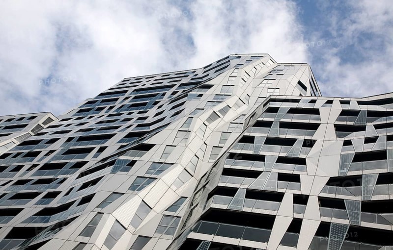 Modern architecture of the Calypso mixed use urban development project Rotterdam, Netherlands designed by British architect Will Alsop which includes 408 apartments, 500 covered parking spaces, and 6, 500 square meters of commercial space