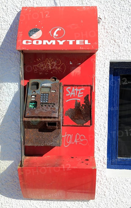 Old disused broken Comytel public telephone booth phone, Almeria, Spain, Europe