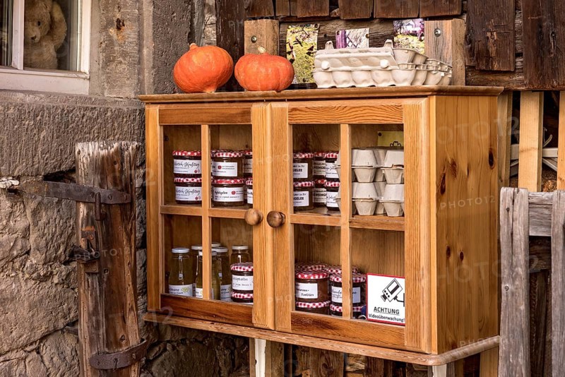 Showcase for private sale, homemade specialities, jams, marmalades, eggs, pumpkins, self-service cabinets, video surveillance warning sign, historic old town, Michelstadt, Odenwald, Hesse, Germany, Europe
