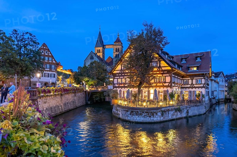 View from the Agnes Bridge to the Roßneckarkanal, half-timbered house with gastronomy and the parish church of St. Dionys at dusk, Esslingen am Neckar, Baden-Württemberg, Germany, Europe