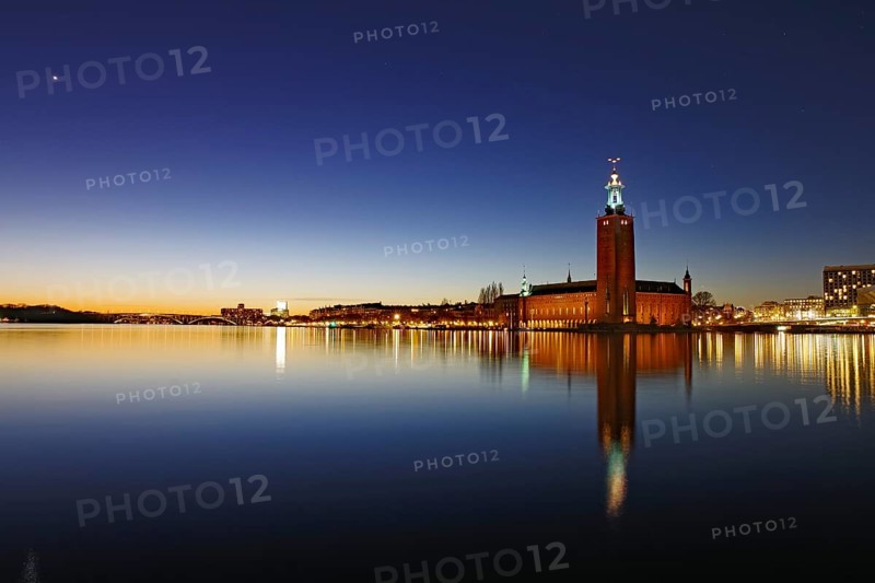 Illuminated silhouette of the town hall at night with reflections in the water, Stadshus, Nobel Prize, Stockholm, Sweden, Europe