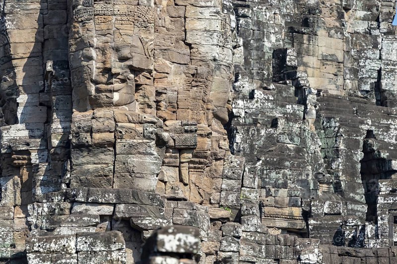 Panoramic image of giant stone-carved faces of the Bodhisattva Lokeshvara, also known as Avalokiteshvara, Bayon Temple, Angkor Thom, UNESCO World Heritage Site, Angkor Wat, Siem Reap, Cambodia, Asia