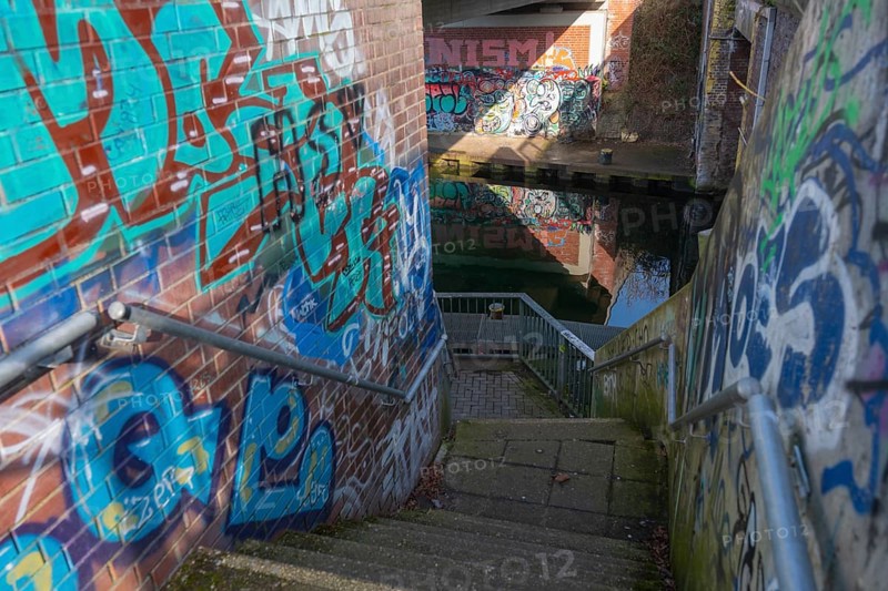 Stairs under the city railway bridge to the canal, graffiti, waterway, Linden harbour lock, Limmer, Linden, Hanover, Lower Saxony, Germany, Europe