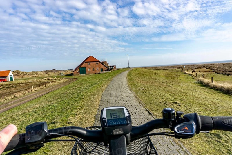 The East Frisian North Sea island of Juist in winter, cycling in the west of the island, on dyke paths, to Domäne Bill, e-bike, Lower Saxony, Germany, Europe