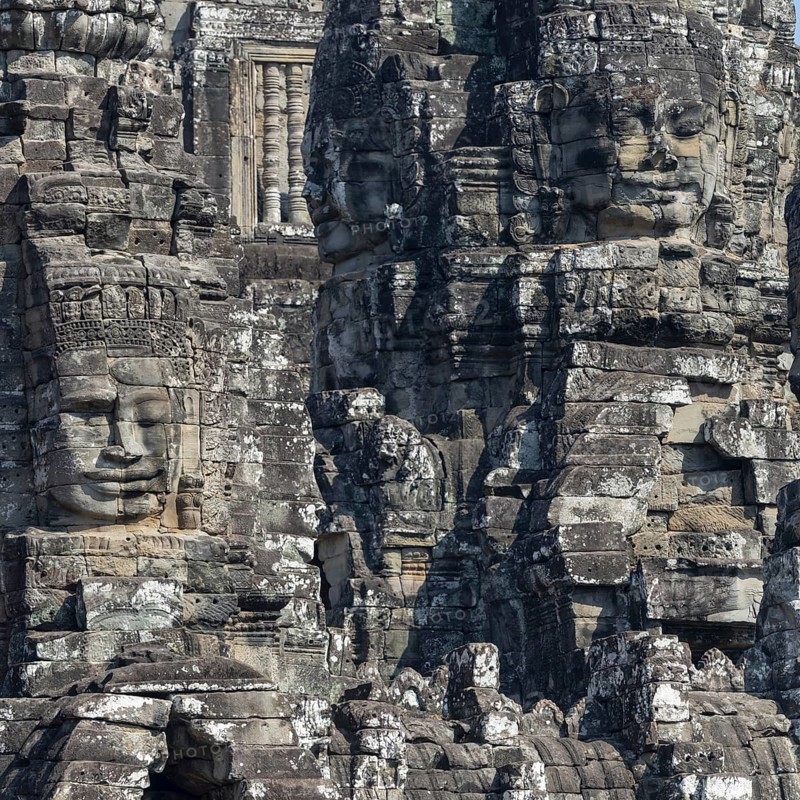 Panoramic image of giant stone-carved faces of the Bodhisattva Lokeshvara, also known as Avalokiteshvara, Bayon Temple, Angkor Thom, UNESCO World Heritage Site, Angkor Wat, Siem Reap, Cambodia, Asia
