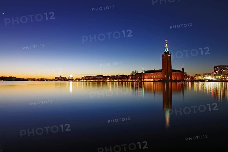 City view at dusk with tower of the town hall and water reflections, Stadshus, Nobel Prize, Stockholm, Sweden, Europe