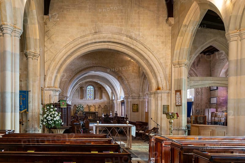 Norman chancel architecture inside church of Saint John the Baptist, Devizes, Wiltshire, England, UK views from nave
