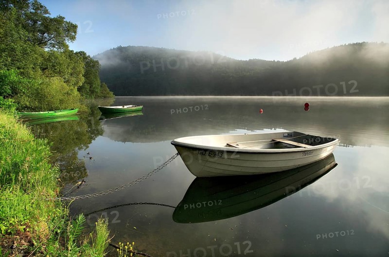 Morning atmosphere with fog over the lake, rowing boats, fishing boats lying on the shore, Edersee, Edertalsperre, Hesse, Germany, Europe