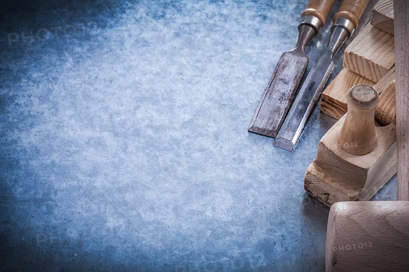 Composition of carpenter's tools on metallic background construction concept