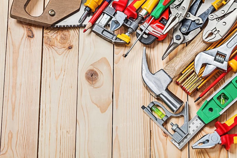 Big sset of construction tools on wood boards