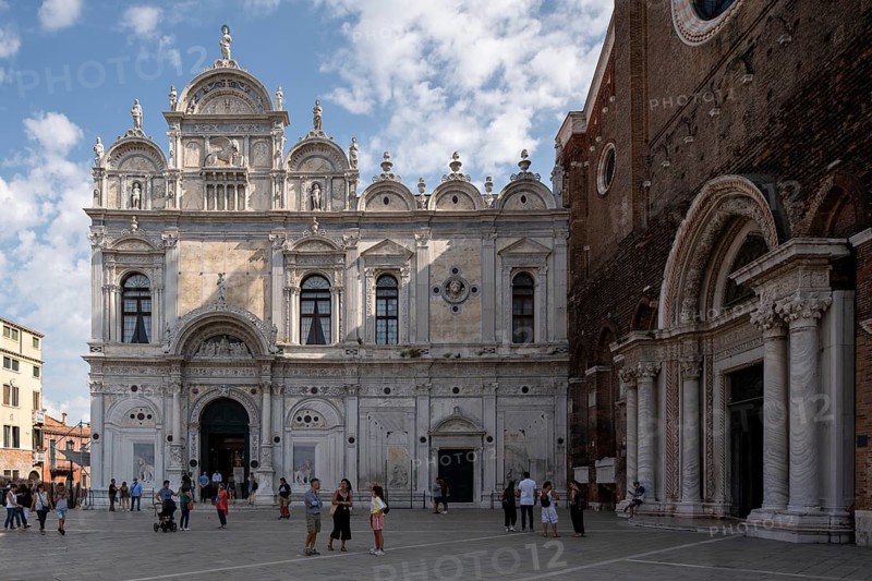 Venice, Scuola Grande di San Marco, façade by Pietro Lombardo 1488-1490 and Mauro Codussi until 1495. On the right the portal of Santi Giovanni e Paolo, Venetian San Zanipolo
