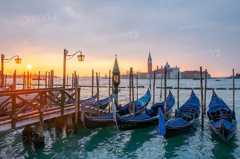 Cloudy atmosphere at sunrise, gondolas, San Giorgio Maggiore church in the background, Venice, Veneto, Italy, Europe