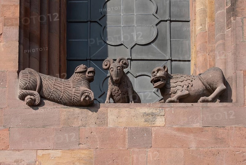 Worms, St Peter's Cathedral, east choir, figures under the large windows: lions and rams