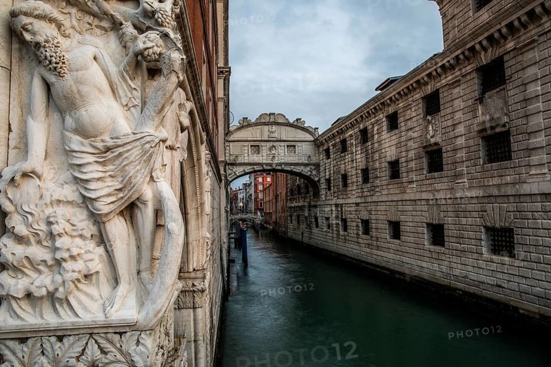Stone sculpture of an ancient deity, Bridge of Sighs or Ponte dei Sospiri at the Doge's Palace over the Rio di Palazzo, Venice, Veneto, Italy, Europe