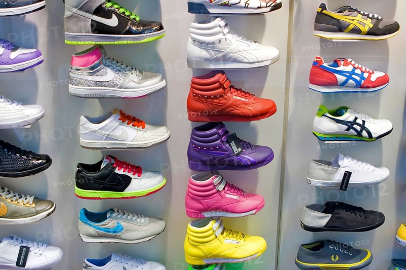 Colourful decorative shoes for sale in store, London, UK United Kingdom England