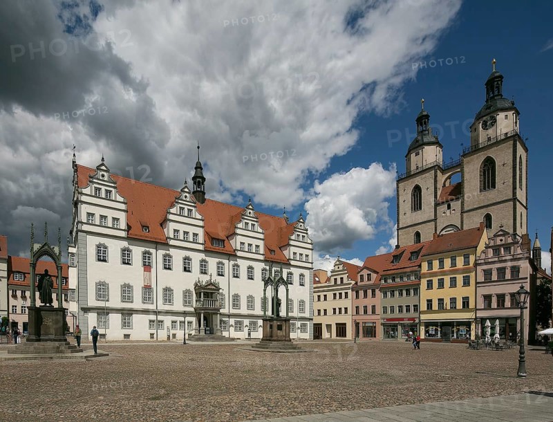 Luther city Wittenberg Market Square 6369 left Town Hall 16th century right Towers of the town church 13th-16th century on the square Monuments to Melanchton and Luther 19th century