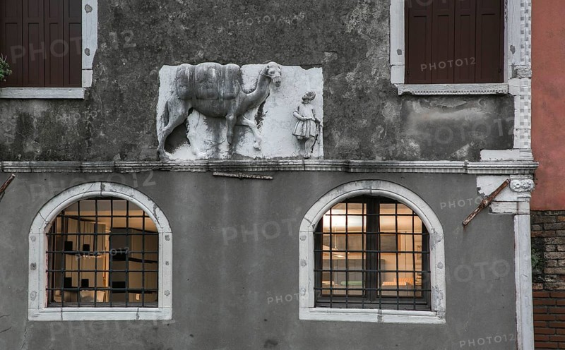 Italy Venice Palazzo Mastelli -440 early Gothic built in the 14th century above the plinth on the right relief of a camel with a guide