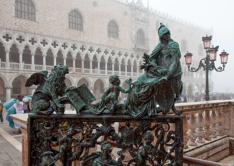 Italy Venice Loggetta at the Campanile -41 bronze door decorated with figures in the course of the balustrade to the Piazzetta by Antonio Gai 18th century behind the west wing of the Doge's Palace in the mist