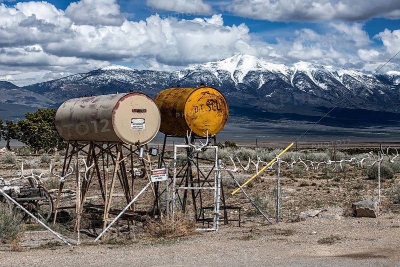 Truck stop with oil barrels and a fence of deer antlers, Highway 50, Loneliest Road in America, Ely, Nevada, USA, North America