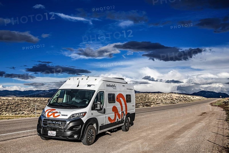 Motorhomes in the midst of wild thunderstorms and rain clouds, on the Great Basin Highway US 93, between Ely and Baker, Nevada, USA, North America