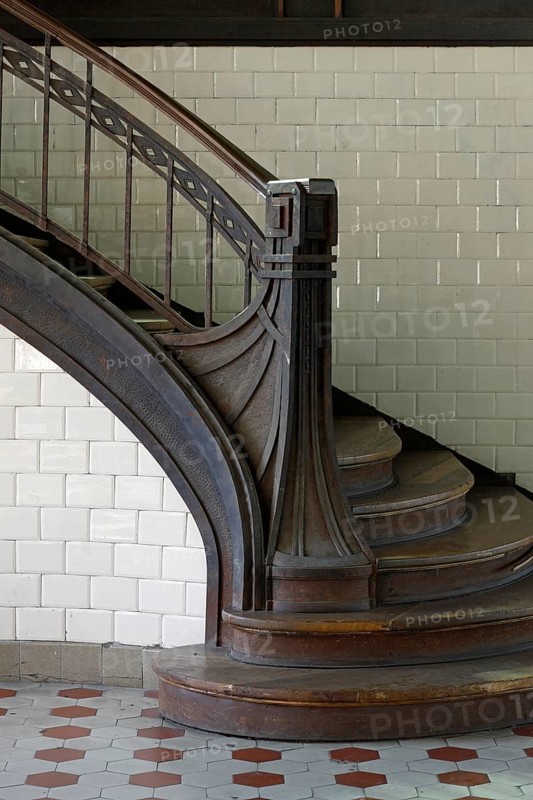 Staircase post with iron bands in Art Nouveau style