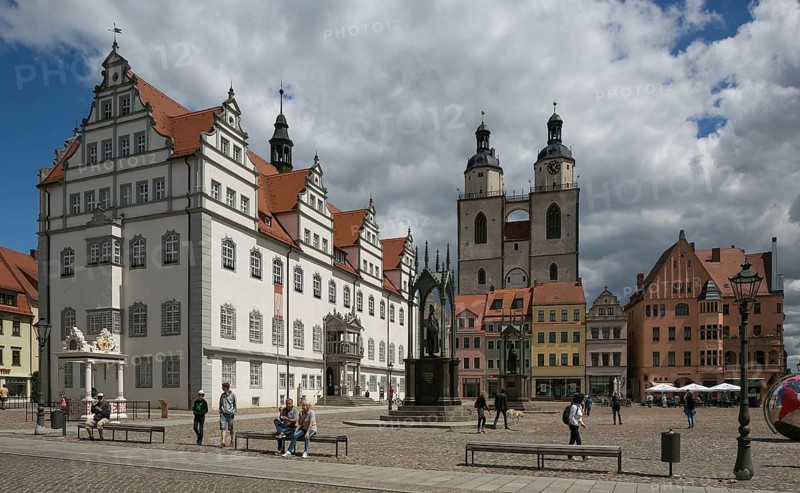 Luther city Wittenberg Market Square 6301 left Town Hall 16th century centre Towers of the town church 13th-16th century on the square Monuments to Melanchton and Luther 19th century