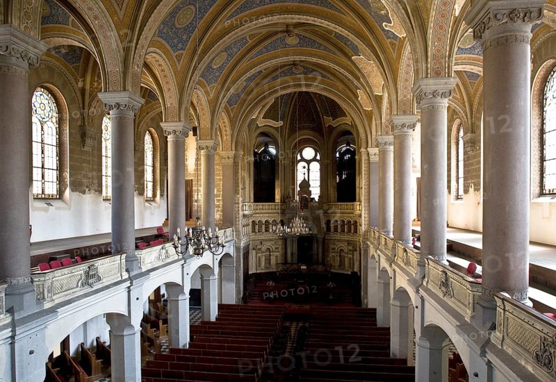 Czech Rep Plzen/Pilsen. The Great Synagogue in Pilsen is Europe's second largest synagogue (after the Great Synagogue in Budapest) and the third largest in the world. It was designed by architect Emanuel Klotz in Moorish-Romanesque style. The foundation stone was laid in December 1888 and the building was completed in 1893. Interior. Longitudinal view at gallery level to the Torah shrine