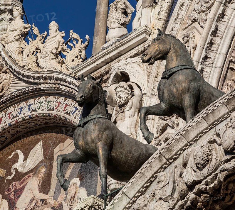 Italy Venice St Mark's Basilica -506 on the gallery of the west façade two of the bronze horses captured in Constantinople in 1204 (copies)