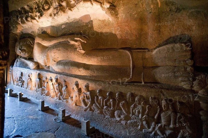Huge figure of reclining buddha laying back in preparation for nirvana at ajanta caves, Aurangabad, Maharashtra, India, Asia