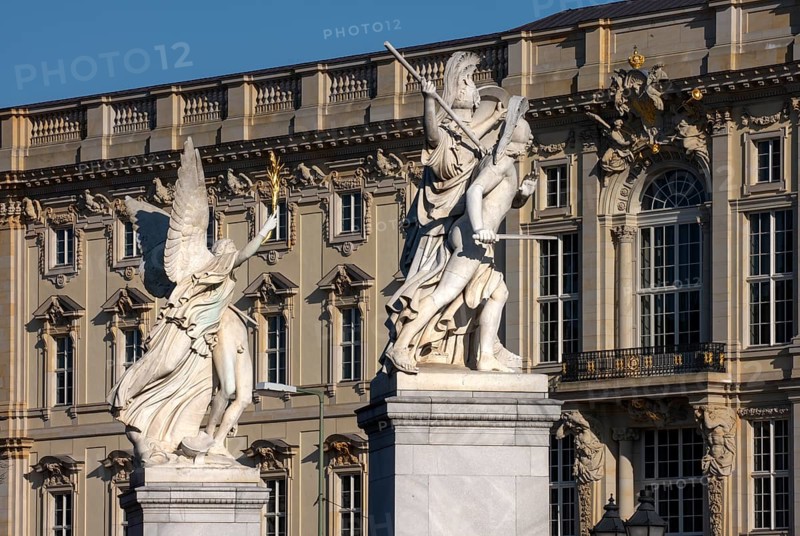 Berlin, Humboldt Forum in the Berlin Palace, in front of figures on the Palace Bridge