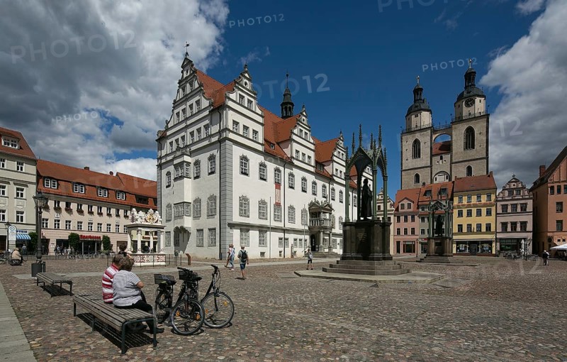 Luther city Wittenberg Market Square 6358 left Town Hall 16th century right Towers of the town church 13th-16th century on the square Monuments to Melanchton and Luther 19th century