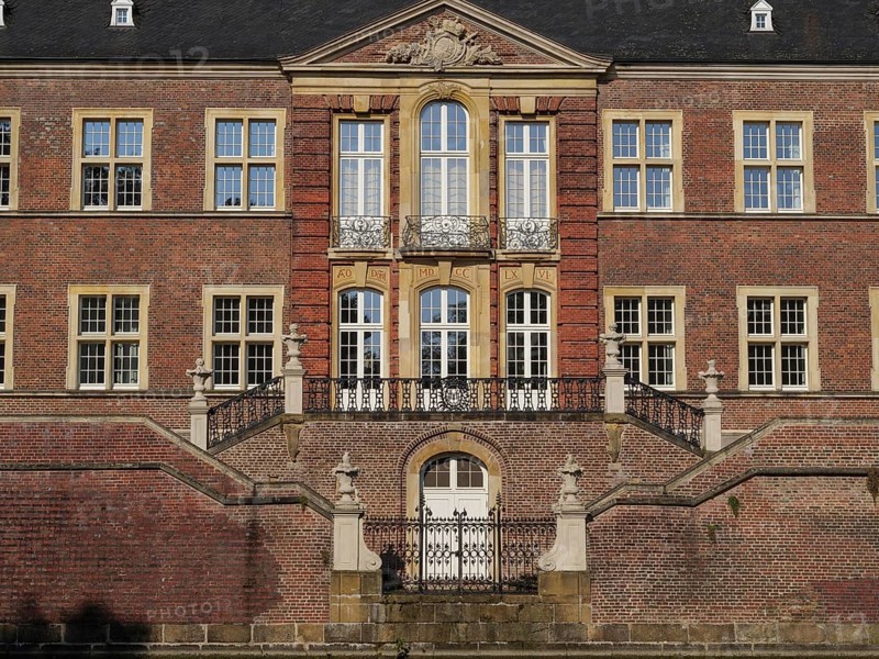 Magnificent red brick castle façade with ornate windows and symmetrical staircase, ahaus, westphalia, germany